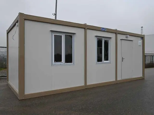 Standard container unit with its personnel door moved to the end bay, one of the standard door positions