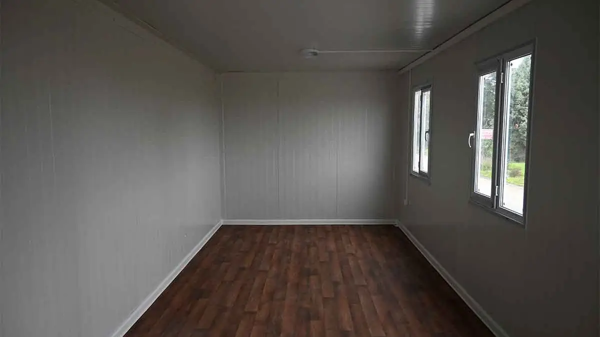 Interior of a standard Karmod container unit as delivered: lined, floored and glazed, ready for fit-out