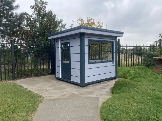 Small grey MetroCity cabin staffing a footpath gate into a university campus